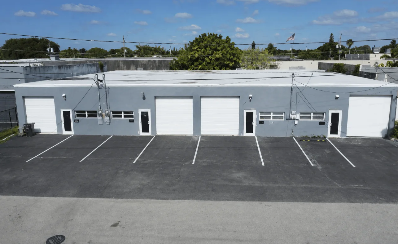 Exterior of a multi-tenant flex industrial building with dock doors
